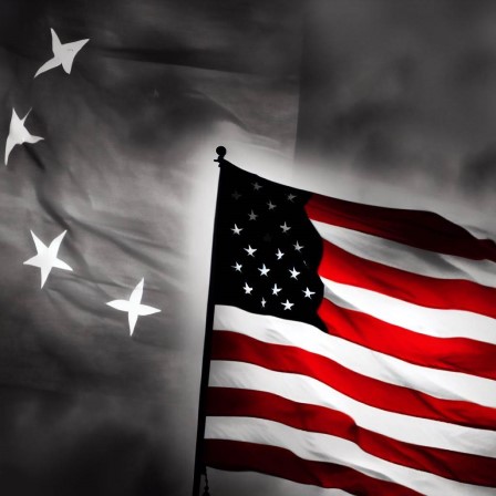 China Flag Behind U.S. Flag